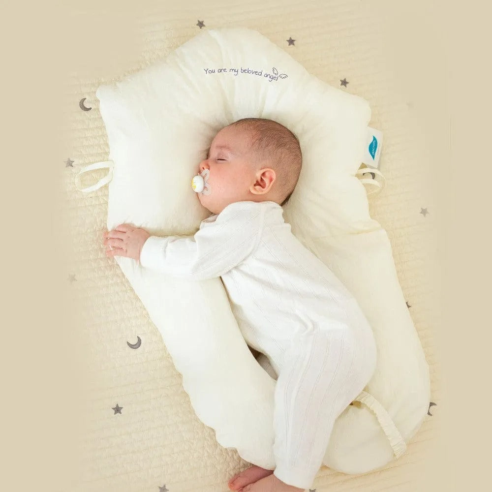 Almohada de soporte para bebés con laterales ajustables y zona para la cabeza