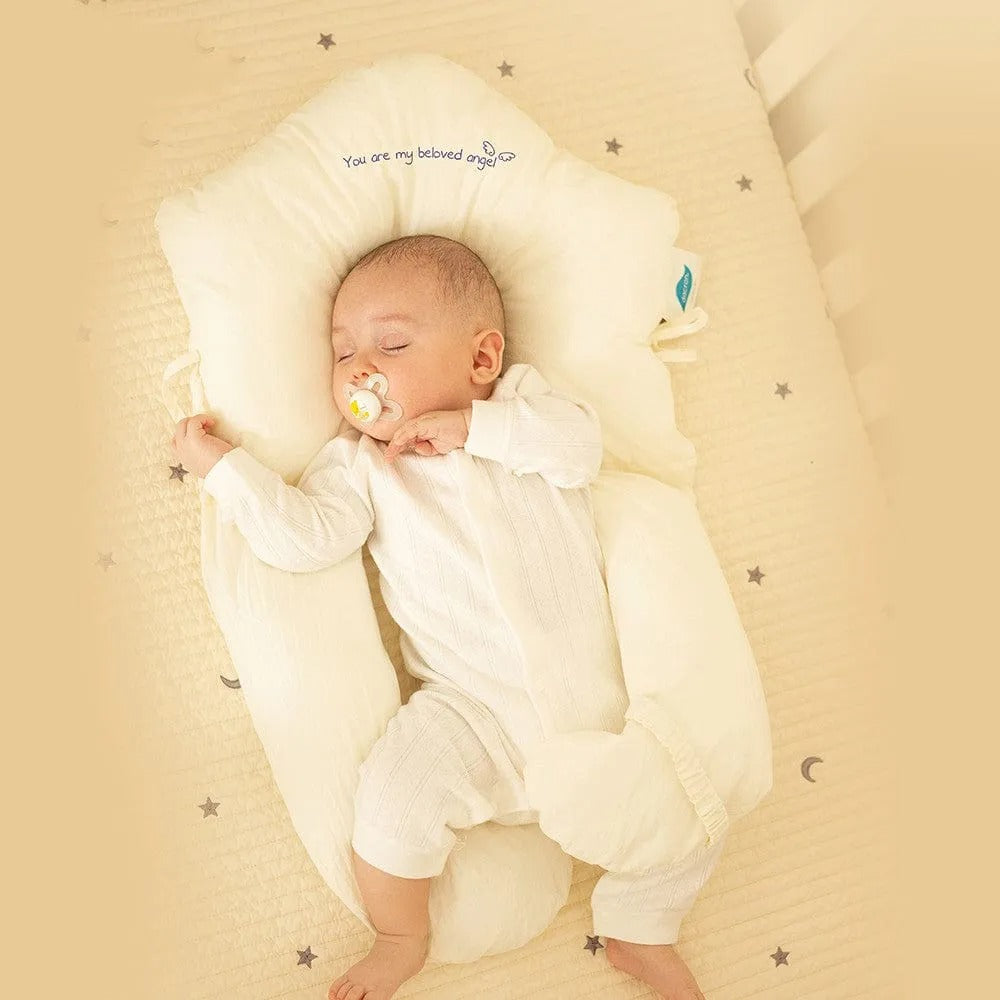 Almohada de soporte para bebés con laterales ajustables y zona para la cabeza