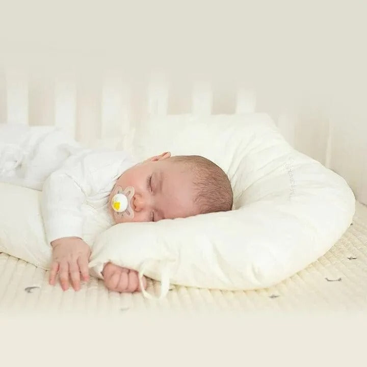 Almohada de soporte para bebés con laterales ajustables y zona para la cabeza