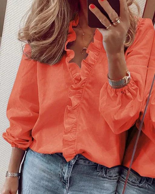 Blusa de mujer con volantes y manga larga