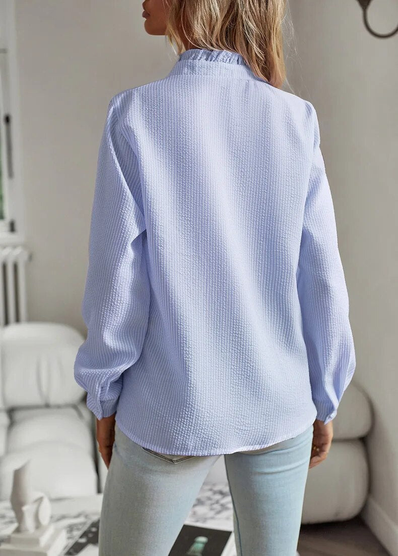 Blusa de mujer de manga larga con volantes