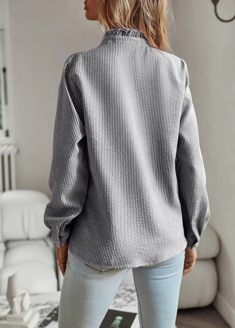 Blusa de mujer de manga larga con volantes