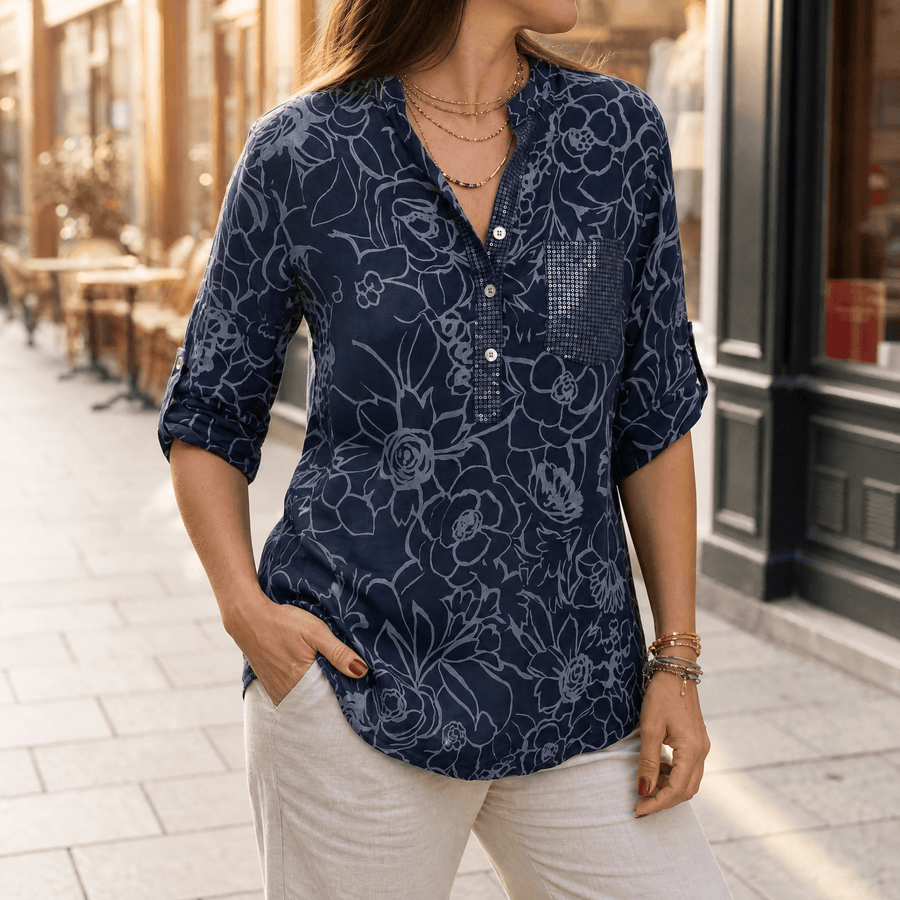 Blusa floral con bolsillo de lentejuelas