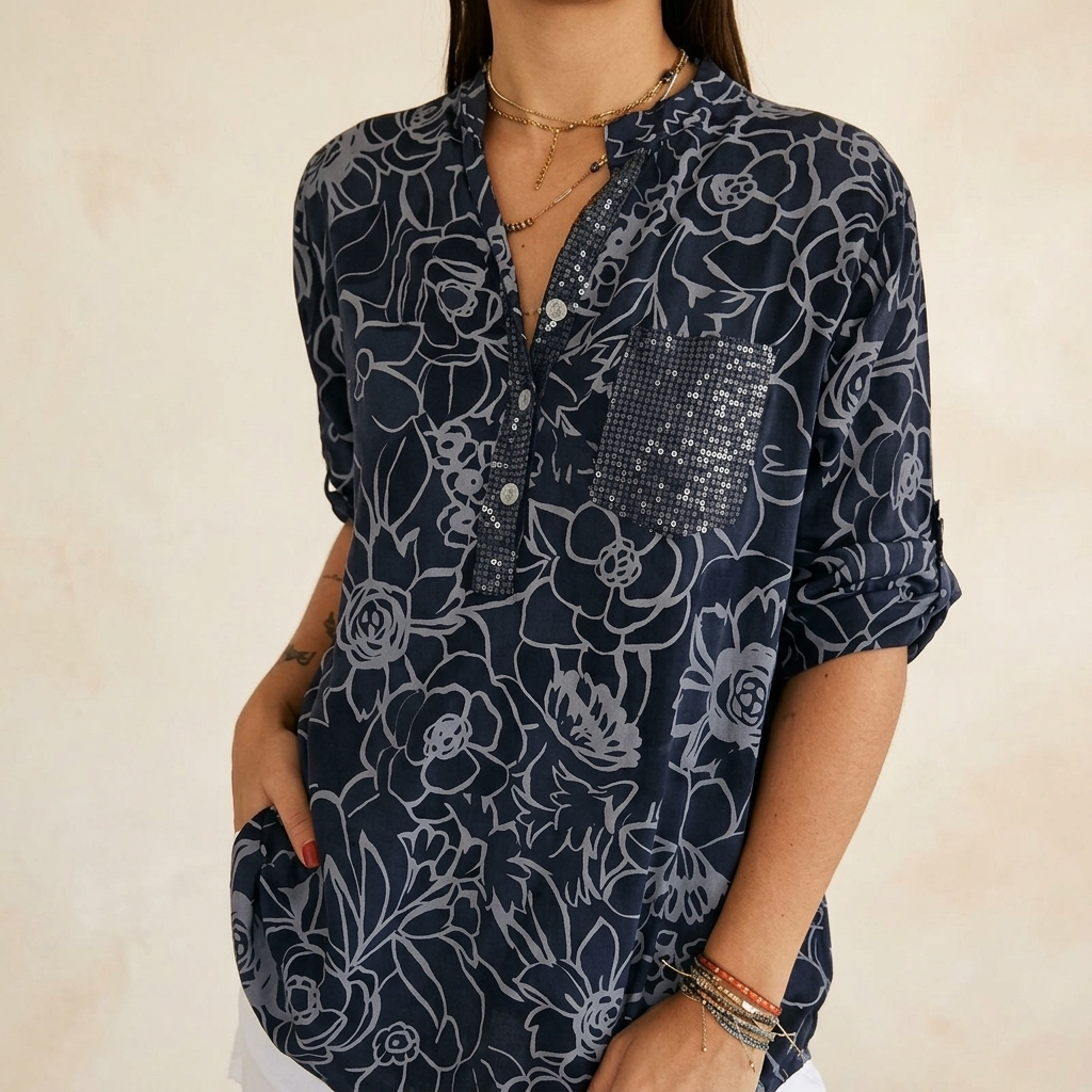 Blusa floral con bolsillo de lentejuelas