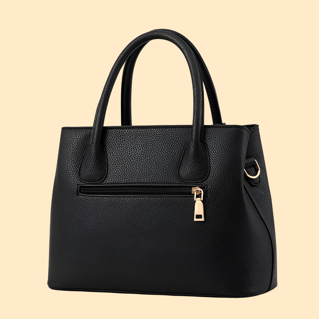 Bolso de mano estructurado con detalle de flecos