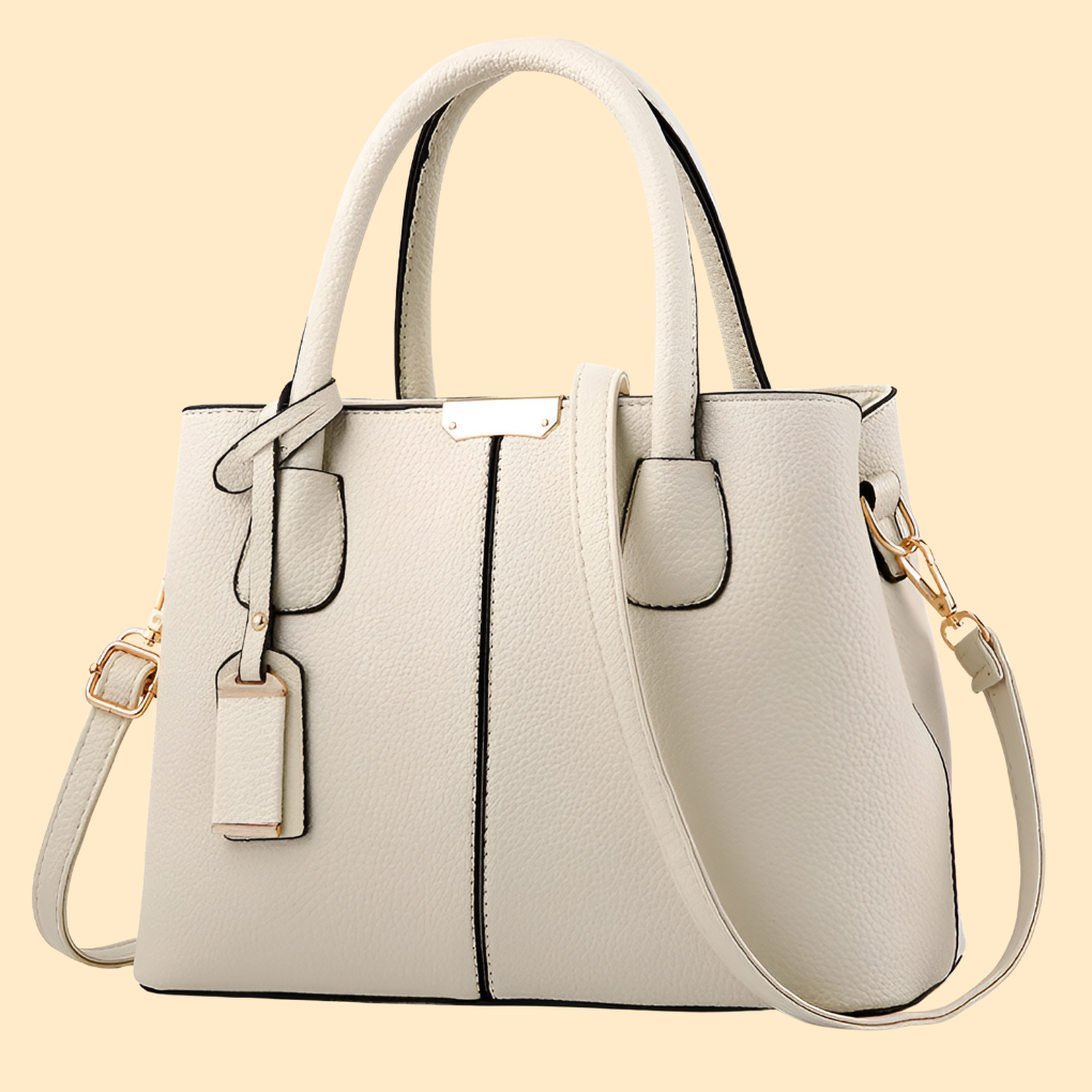 Bolso de mano estructurado con detalle de flecos