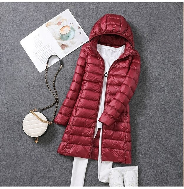 Chaqueta plumífero larga para mujer con capucha extraíble