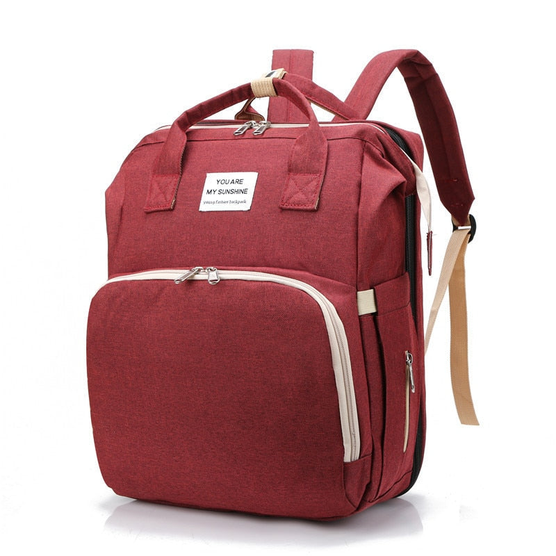 Cuna portátil para bebé y bolso cambiador – Mochila de viaje multifuncional