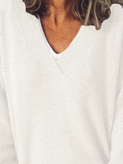 Elegante jersey de punto oversized para mujer con cuello en V