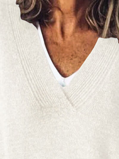 Elegante jersey de punto oversized para mujer con cuello en V