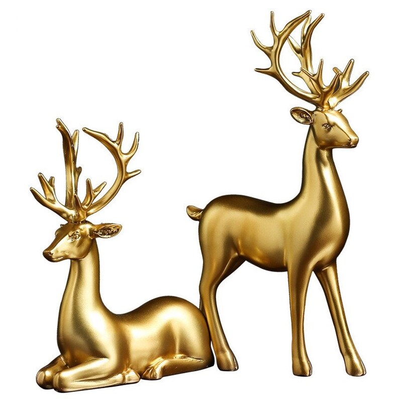 Figurillas de pareja de ciervos dorados