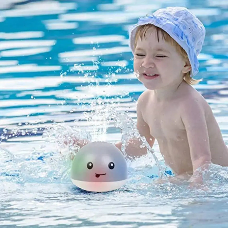 Juguete de baño con forma de ballena y lanzador de agua