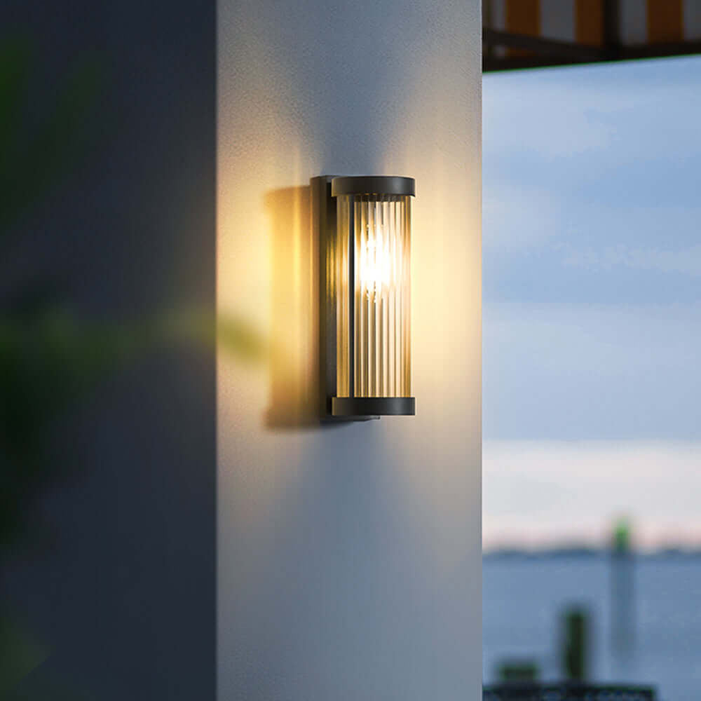 Lámpara solar cilíndrica de exterior en metal y vidrio