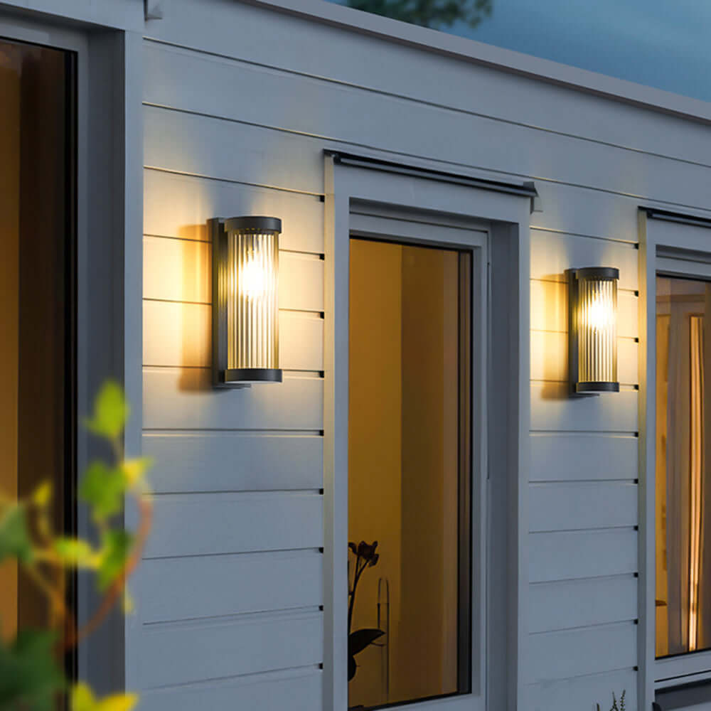 Lámpara solar cilíndrica de exterior en metal y vidrio