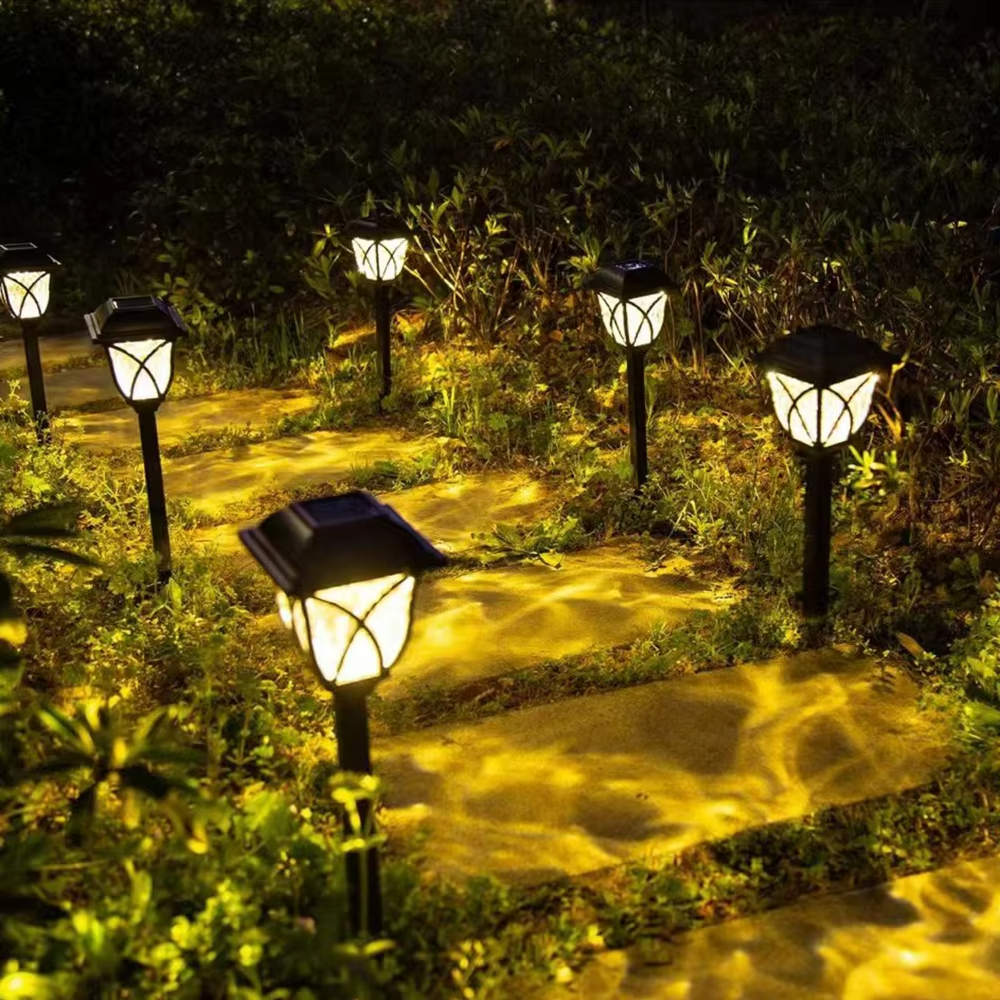 Lámpara solar LED de exterior para jardín y caminos con luz cálida