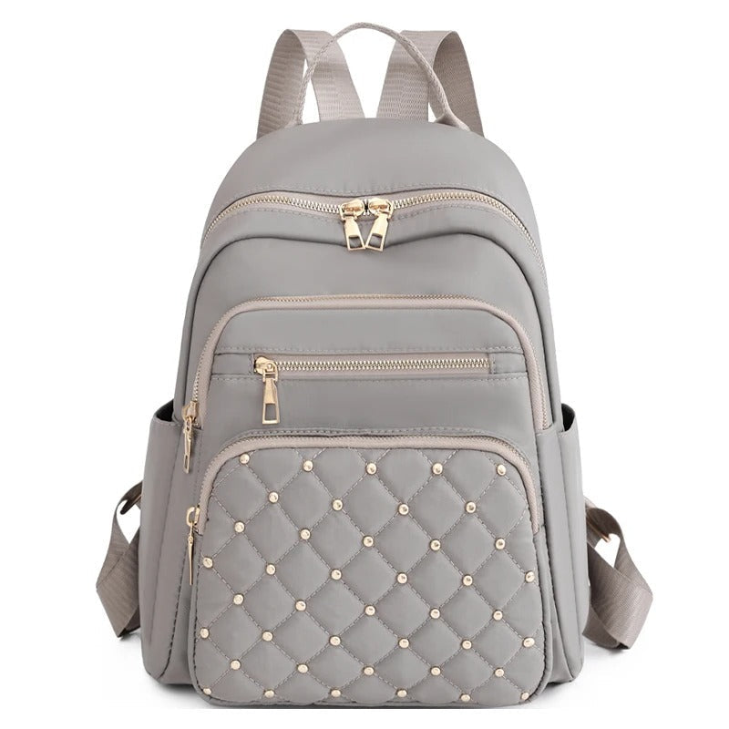 Mochila ligera de nailon resistente al agua para mujer para viajes y uso escolar