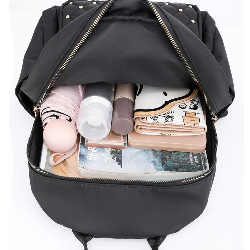 Mochila ligera de nailon resistente al agua para mujer para viajes y uso escolar