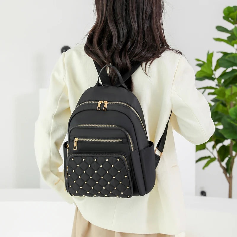 Mochila ligera de nailon resistente al agua para mujer para viajes y uso escolar