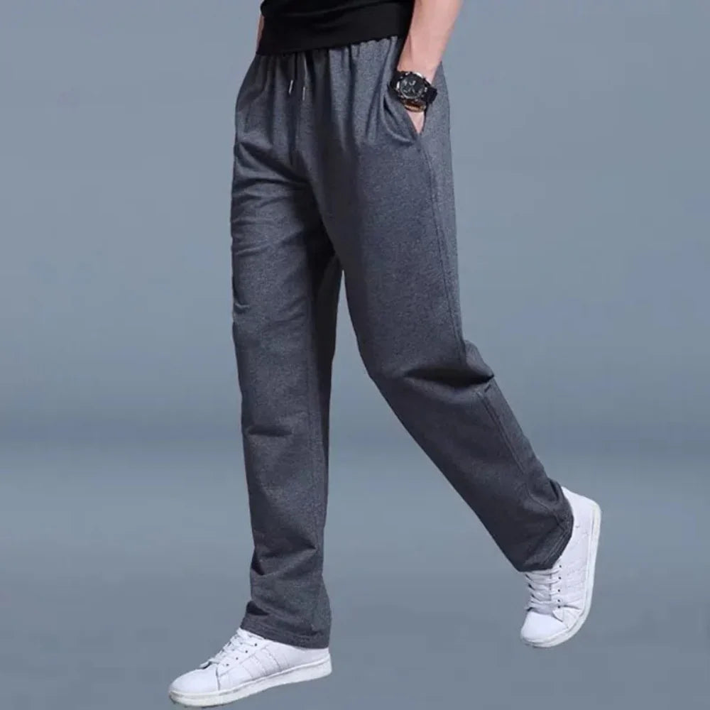 Pantalón de chándal para hombre de corte holgado en tejido mixto transpirable con cintura elástica y bolsillos laterales