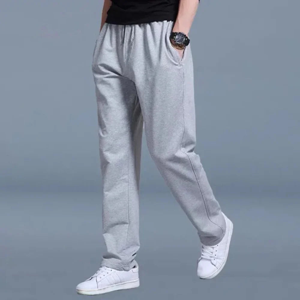Pantalón de chándal para hombre de corte holgado en tejido mixto transpirable con cintura elástica y bolsillos laterales