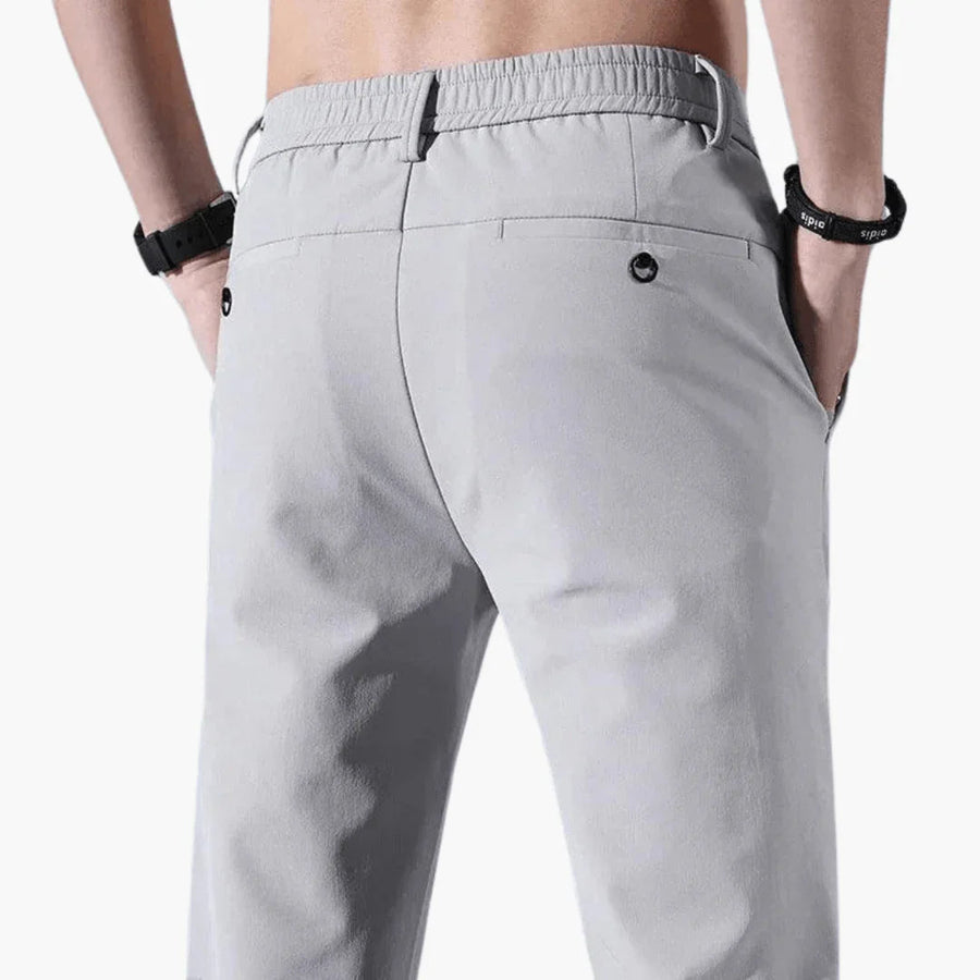 Pantalón slim fit para hombre con cintura elástica y cremallera
