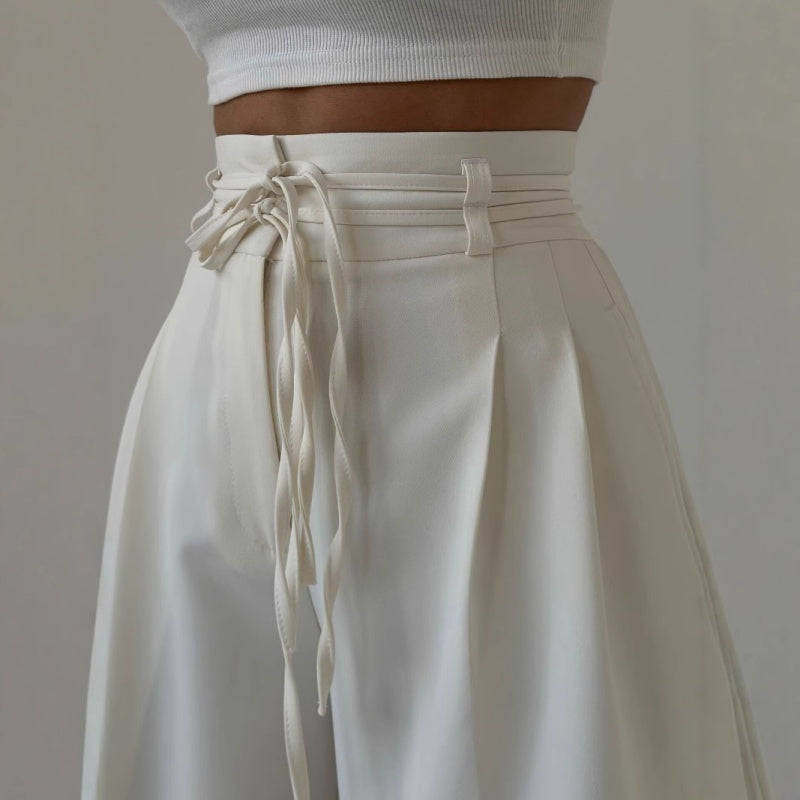 Pantalones de talle alto con pliegues y perneras anchas para mujer