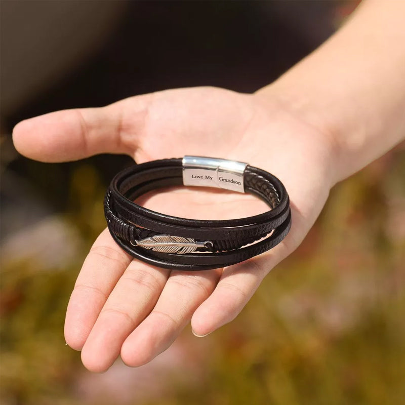 Pulsera con diseño de pluma y acero