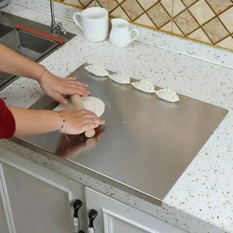 Tabla de cortar de acero inoxidable con borde antiderrames