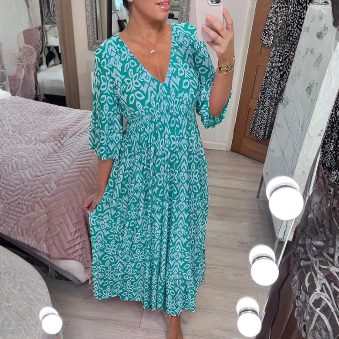 Vestido maxi de verano elegante con estampado, escote en V y caída fluida