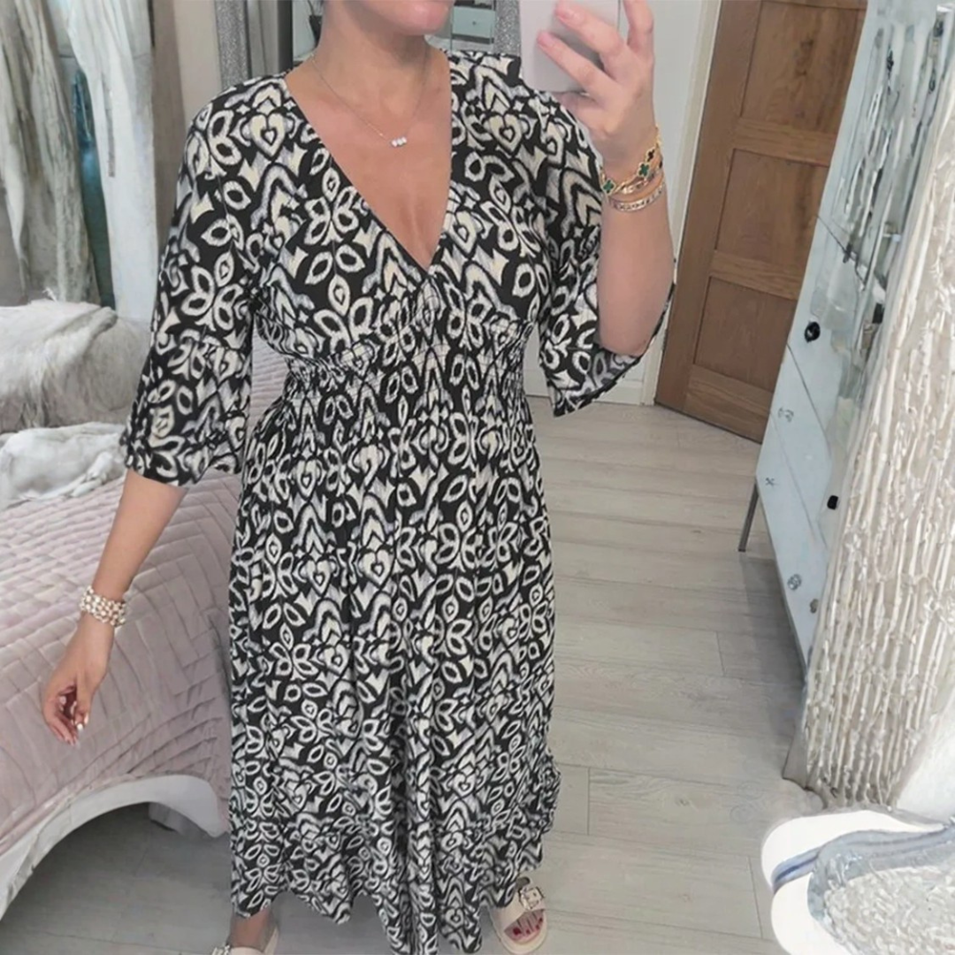 Vestido maxi de verano elegante con estampado, escote en V y caída fluida