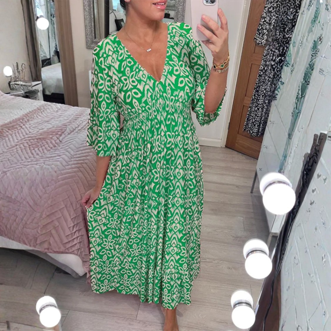 Vestido maxi de verano elegante con estampado, escote en V y caída fluida