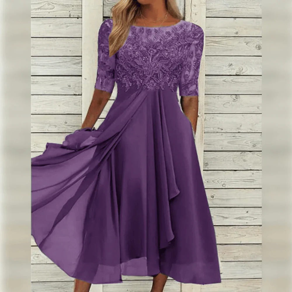 Vestido midi elegante con detalle de encaje y falda fluida para ocasiones especiales