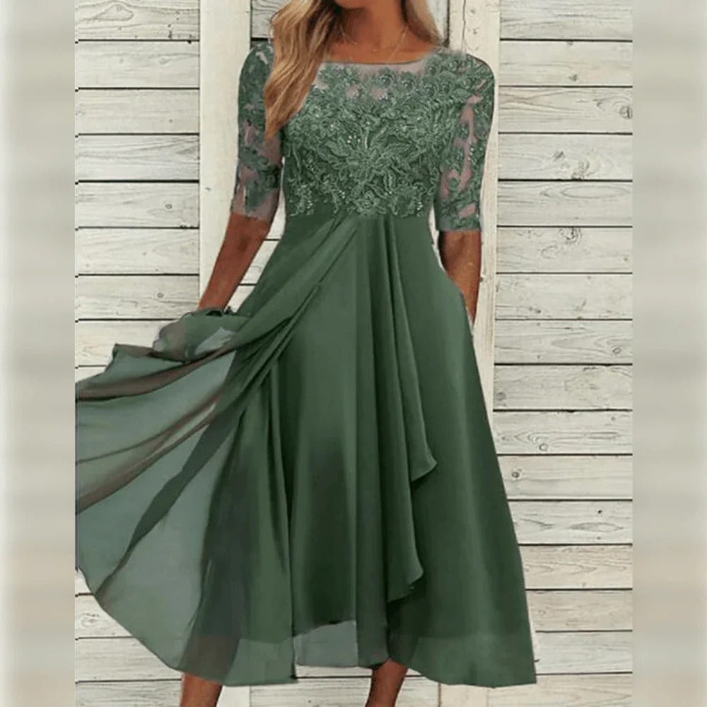 Vestido midi elegante con detalle de encaje y falda fluida para ocasiones especiales