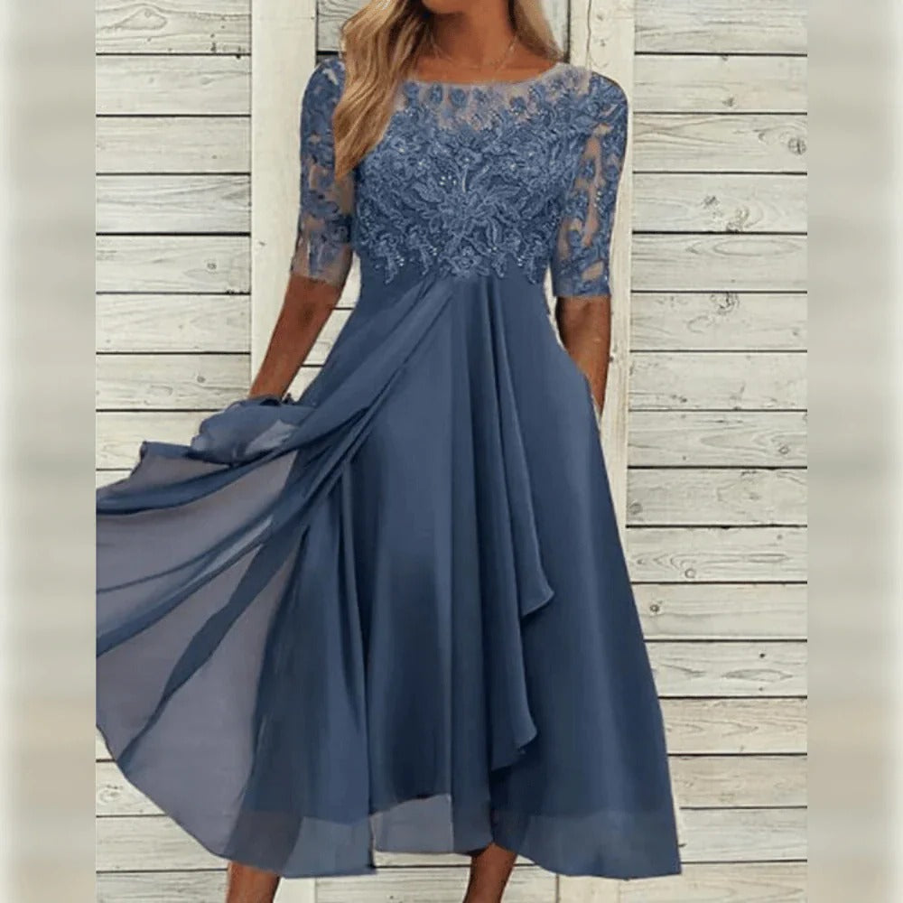 Vestido midi elegante con detalle de encaje y falda fluida para ocasiones especiales