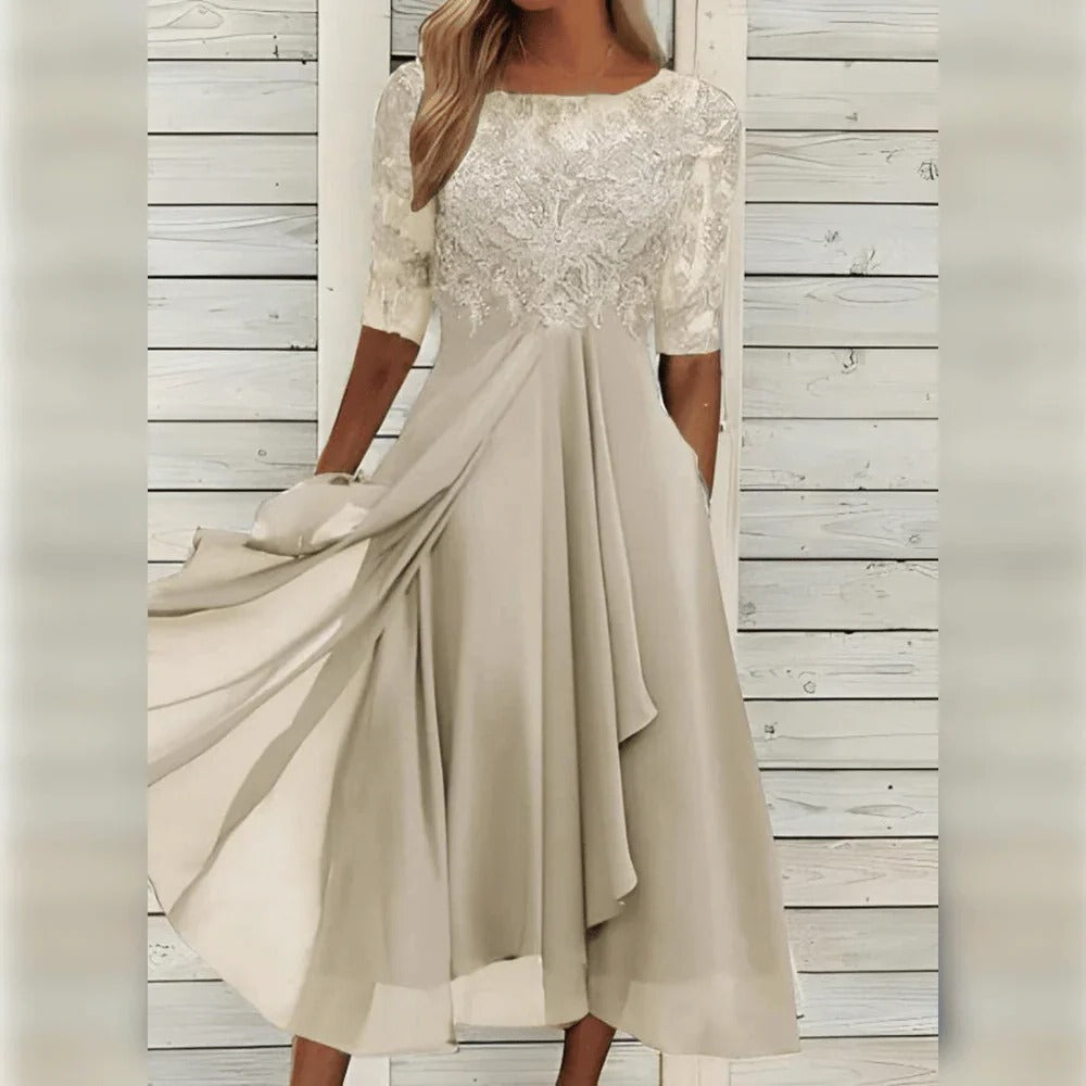 Vestido midi elegante con detalle de encaje y falda fluida para ocasiones especiales