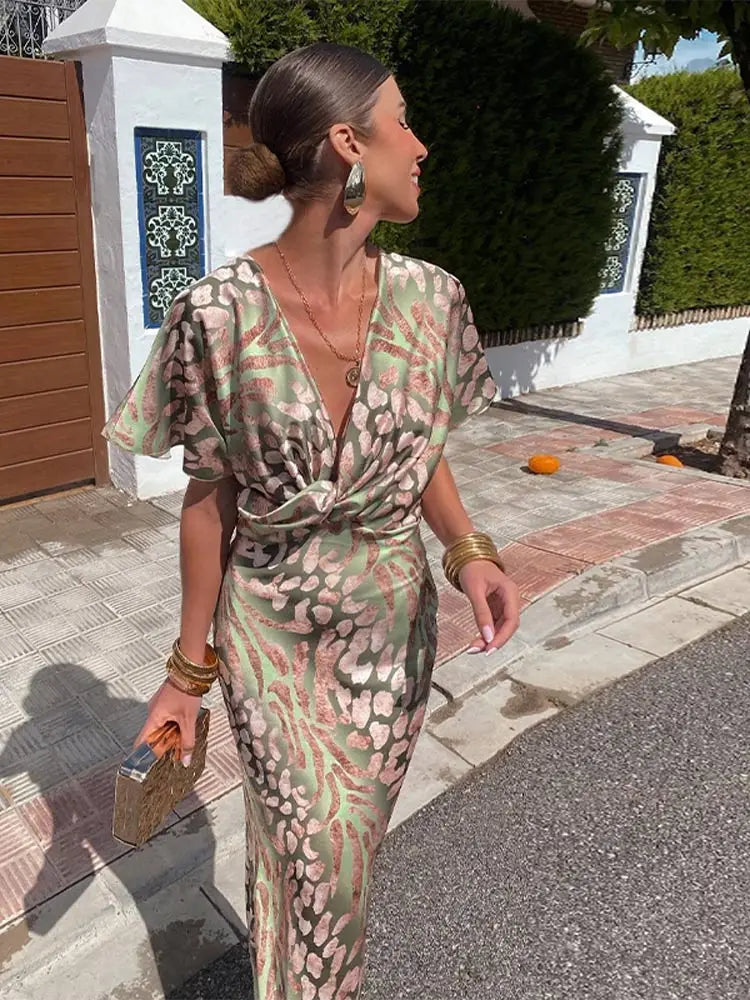 Vestido midi elegante para mujer con escote en V y detalle de nudo