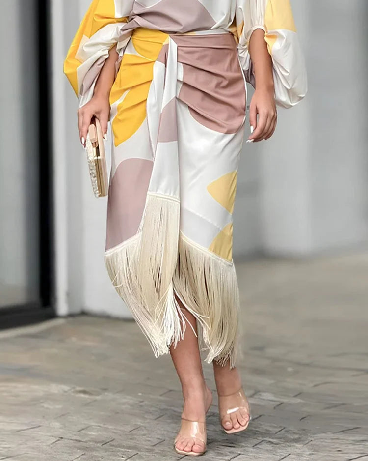 Vestido midi envolvente asimétrico con flecos